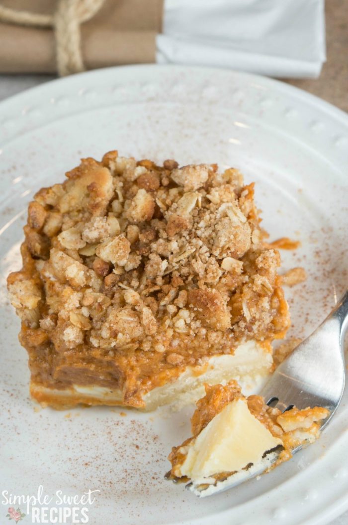 This yummy pumpkin pie layer bar recipes will remind you of a perfect, creamy slice of pumpkin pie! Tender shortbread crust and crumble topping makes it a dessert worthy to share at gatherings! Everyone will love this Fall dessert for Thanksgiving. Sprinkle with pumpkin spice as a pretty garnish.