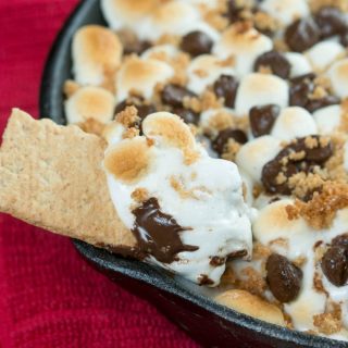 Our yummy S'mores Cookie Bar and Dip combines all your favorite flavors - graham cracker cookie crust, loads of chocolate, and a pile of marshmallows!