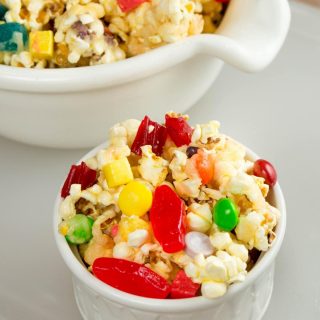 This sweet and salty glazed candy popcorn that is sure to be a delight! Perfect way to use up leftover Halloween candy as a treat for kids and adults alike.