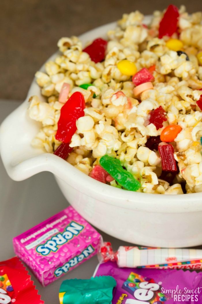 This sweet and salty glazed candy popcorn that is sure to be a delight! Perfect way to use up leftover Halloween candy as a treat for kids and adults alike.