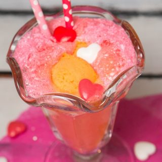 This fun, fruity, Sherbet Italian Soda Punch brings a twist on classic drink with a scoop of sherbet and bubbly Sprite. A perfect treat for Valentine's Day.