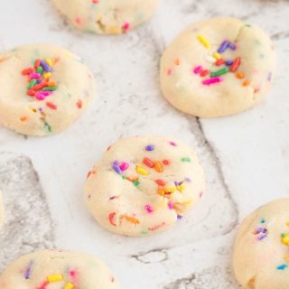 Super soft, these Cheesecake Sprinkle cookies look amazing, and taste great too! So easy with a cheesecake pudding mix as the base. They are a hit at a birthday party or any special occasion.