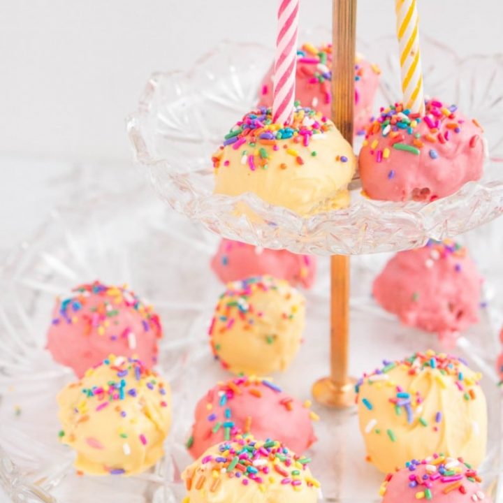 Confetti cake and sprinkles combine for these moist, delicious Sprinkle Birthday Cake Balls. A traditional birthday cake made easier to serve - grab a bite and go! Add candles for a miniature birthday cake!