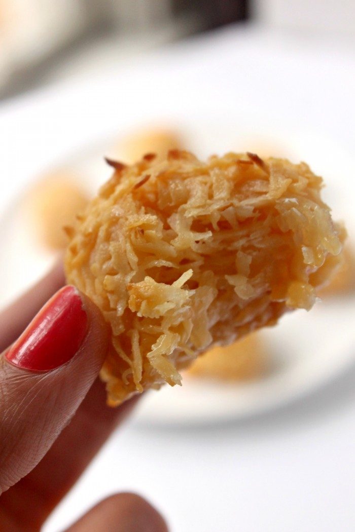 Toasted Coconut Cookies with a bite taken out of it