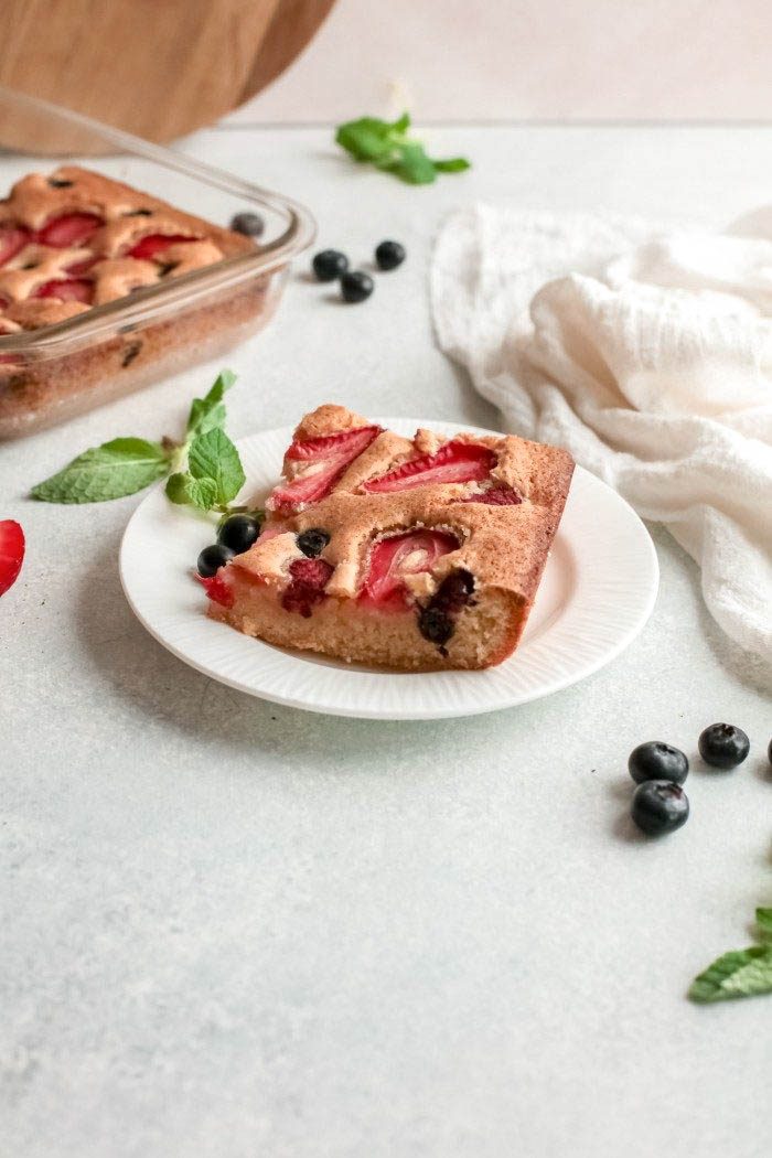 This easy triple berry cake recipe takes just minutes to prep! Incorporate all your favorite fresh berries for this summer recipe in a moist and delicious cake that can be made ahead and frozen! 